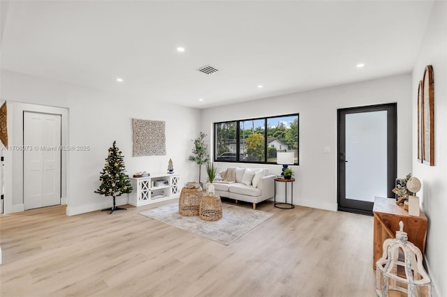 living room with light hardwood / wood-style flooring