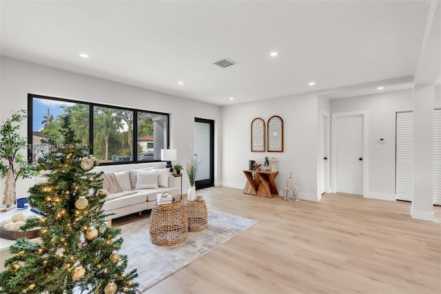 living room with light hardwood / wood-style flooring