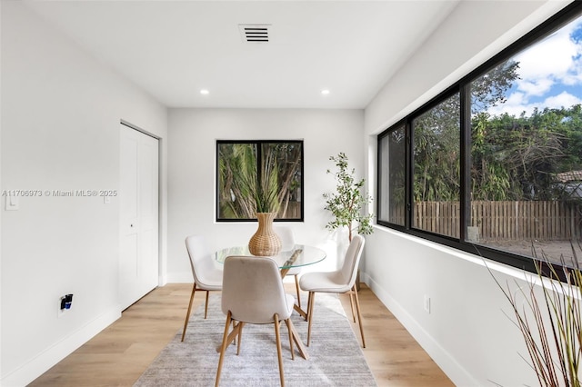 dining space with a healthy amount of sunlight and light wood-type flooring