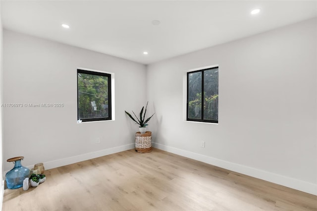 unfurnished room featuring light wood-type flooring