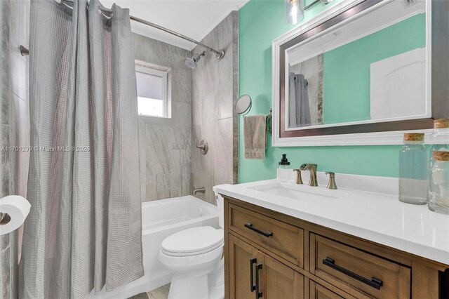 full bathroom with vanity, toilet, and shower / bath combo with shower curtain