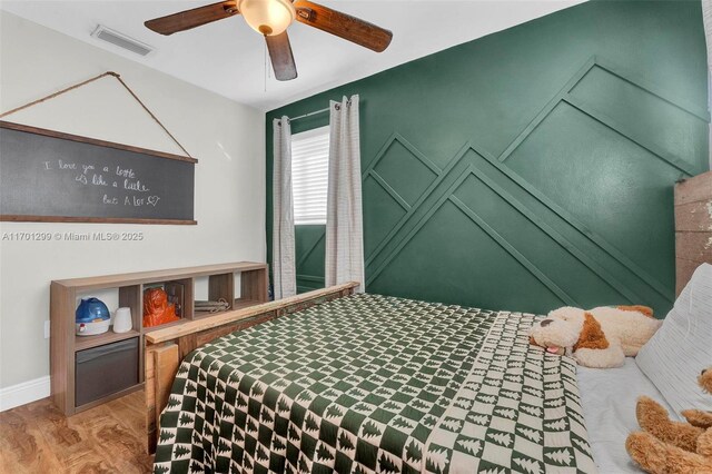 bedroom featuring ceiling fan and wood-type flooring