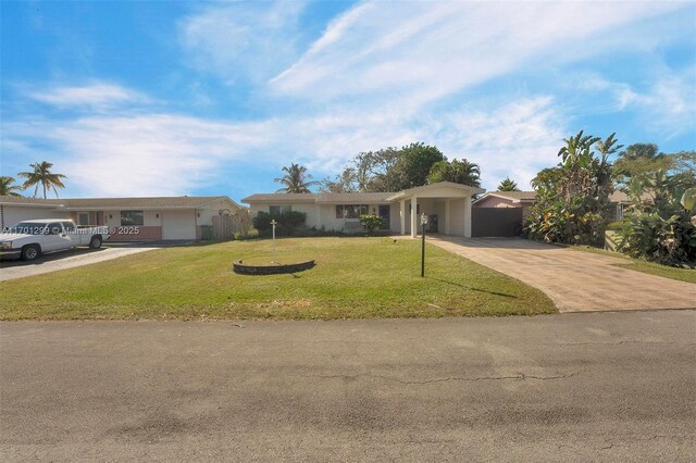 ranch-style house with a front yard and a garage