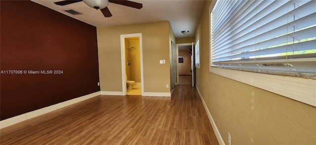 unfurnished room with hardwood / wood-style floors and ceiling fan