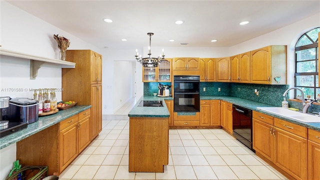 kitchen with a center island, black appliances, sink, hanging light fixtures, and light tile patterned floors