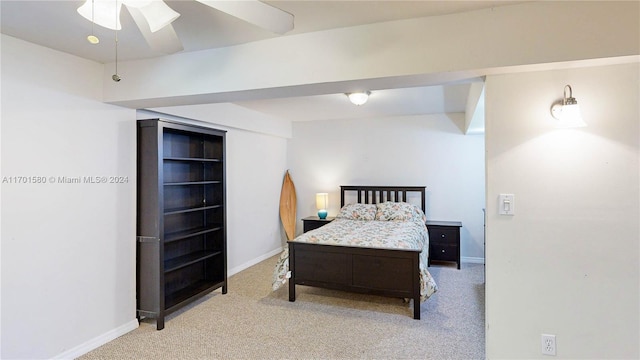 bedroom with ceiling fan and light colored carpet