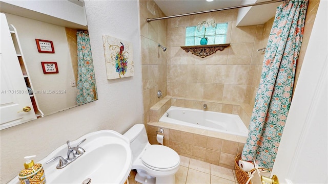 full bathroom with tile patterned floors, sink, shower / bath combination with curtain, and toilet