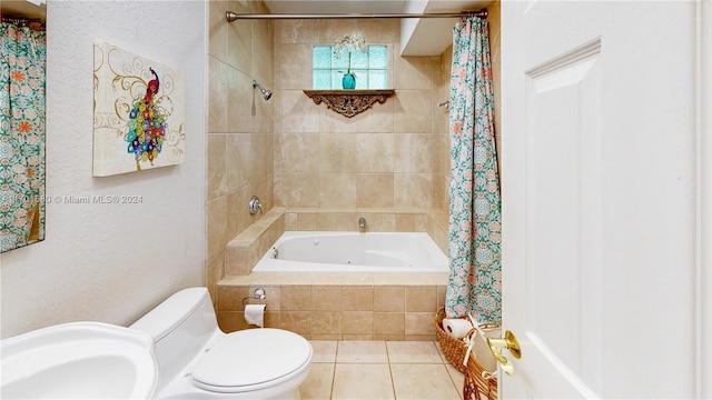 full bathroom with toilet, tile patterned floors, shower / tub combo with curtain, and sink