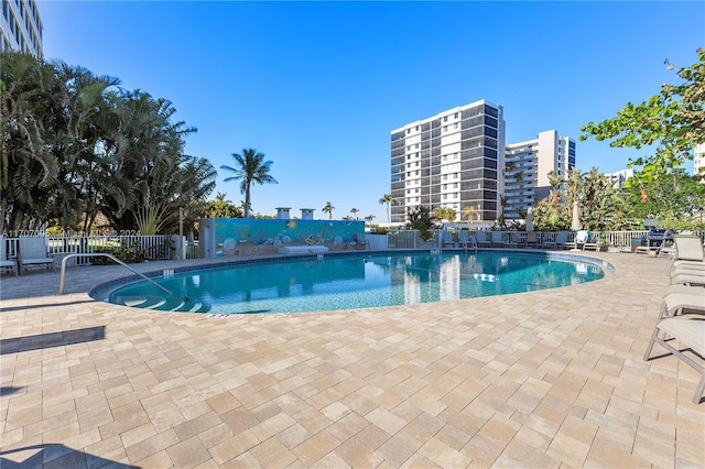 5 Bluebill Unit 701, Naples, FL 34108 - community pool featuring a patio area