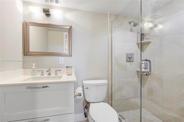 5 Bluebill Unit 701, Naples, FL 34108 - bathroom featuring a stall shower, toilet, and vanity