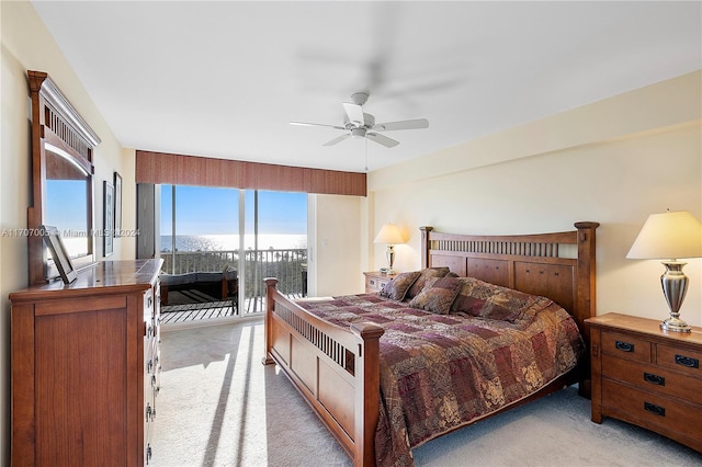 5 Bluebill Unit 701, Naples, FL 34108 - bedroom featuring access to exterior, light carpet, and ceiling fan