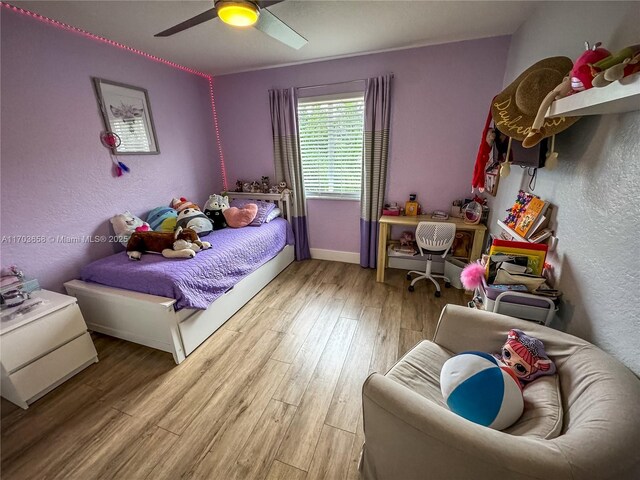 bedroom featuring ceiling fan and wood-type flooring