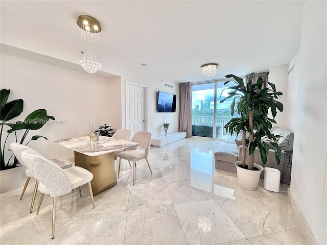 dining room with a chandelier and floor to ceiling windows