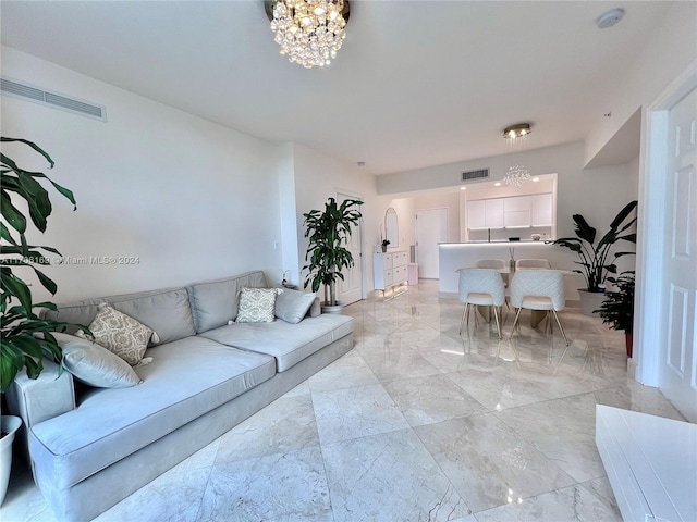 1755 E Hallandale Beach Blvd Unit 405E, Hallandale Beach, FL 33009 - living room featuring a chandelier and light marble finish floors