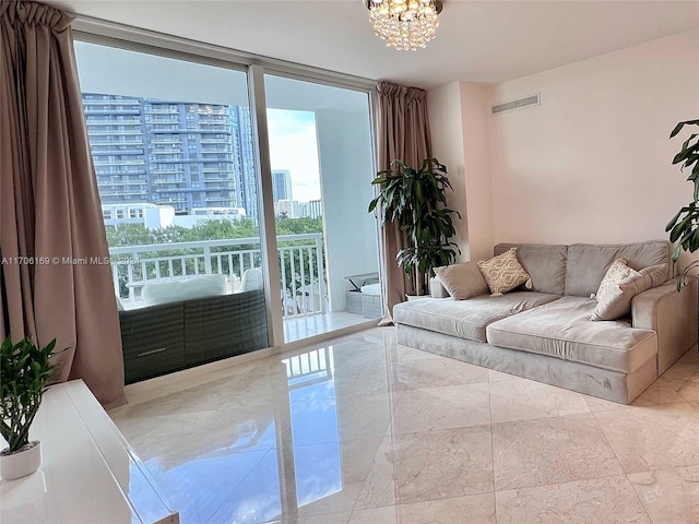 1755 E Hallandale Beach Blvd Unit 405E, Hallandale Beach, FL 33009 - living room featuring a chandelier, marble finish flooring, a view of city, and expansive windows