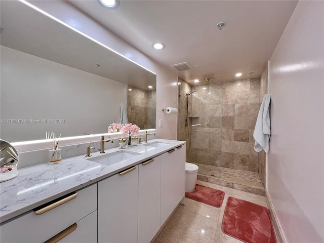 1755 E Hallandale Beach Blvd Unit 405E, Hallandale Beach, FL 33009 - bathroom with double vanity, a tile shower, and recessed lighting