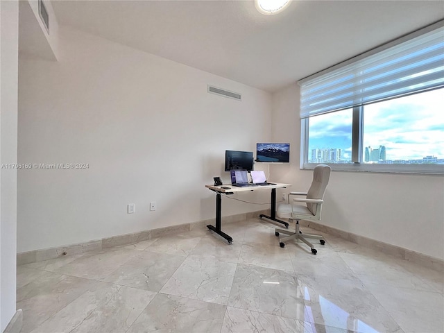 1755 E Hallandale Beach Blvd Unit 405E, Hallandale Beach, FL 33009 - office area with baseboards and marble finish flooring