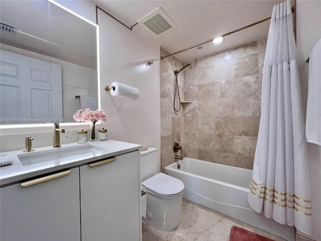 full bathroom with vanity, toilet, and shower / tub combo