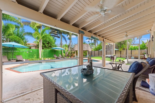 view of pool featuring ceiling fan and a patio area