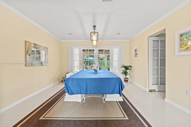 tiled dining space featuring crown molding and french doors