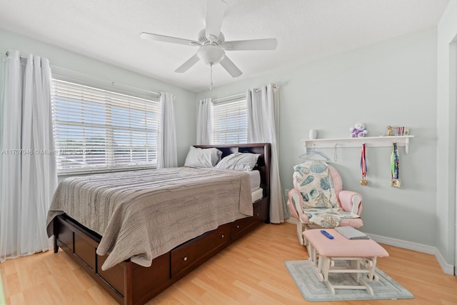 bedroom featuring light wood-type flooring and ceiling fan