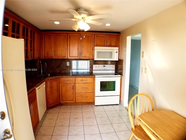 kitchen featuring decorative backsplash, white appliances, ceiling fan, sink, and light tile patterned flooring