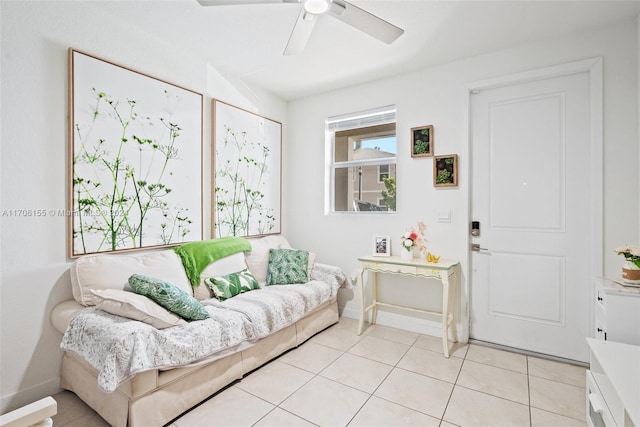 tiled living room with ceiling fan