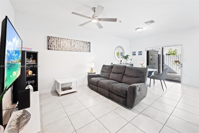 living room featuring light tile patterned floors and ceiling fan