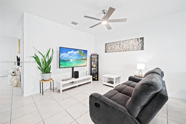 living room featuring ceiling fan and light tile patterned floors