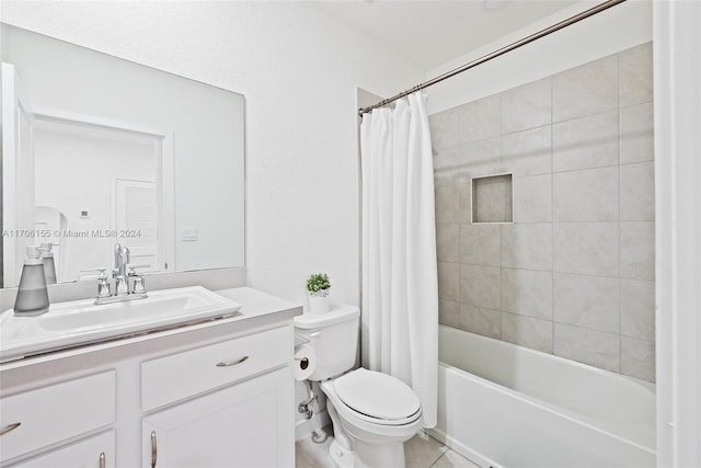 full bathroom featuring tile patterned floors, vanity, shower / bath combo, and toilet