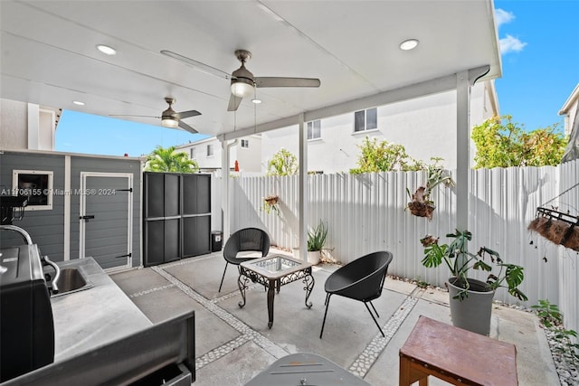 view of patio / terrace featuring ceiling fan