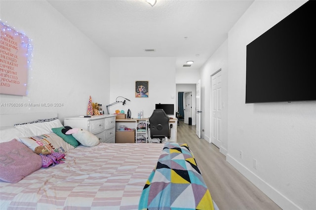 bedroom featuring light wood-type flooring