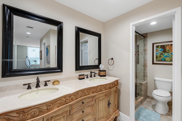 bathroom with vanity, toilet, and walk in shower