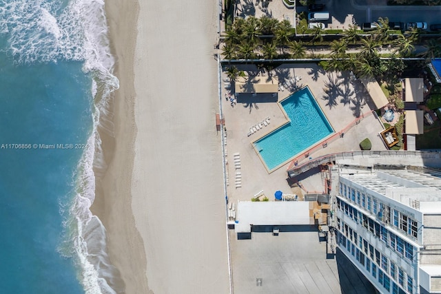 drone / aerial view with a view of the beach and a water view