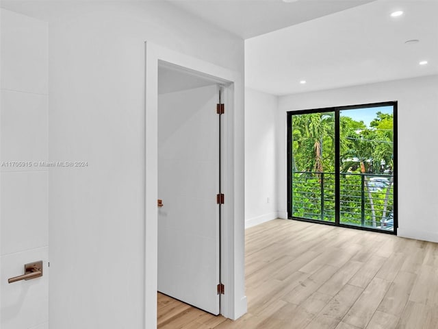 spare room featuring light hardwood / wood-style floors