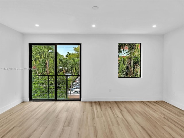 unfurnished room featuring light hardwood / wood-style flooring