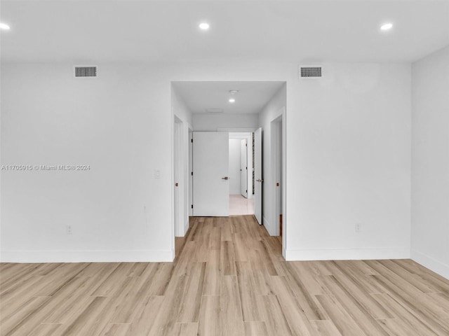 spare room featuring light hardwood / wood-style flooring