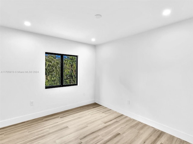 spare room featuring light wood-type flooring