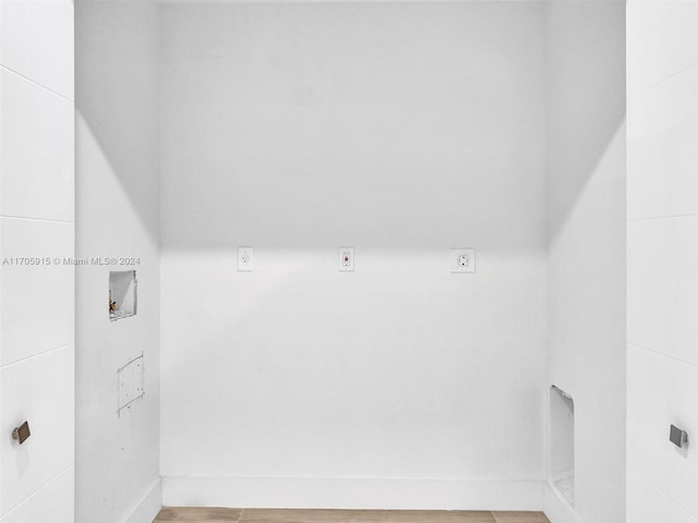 washroom featuring washer hookup and light hardwood / wood-style flooring