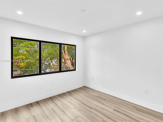 unfurnished room featuring light hardwood / wood-style flooring