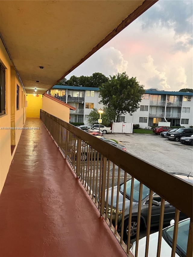 view of balcony at dusk