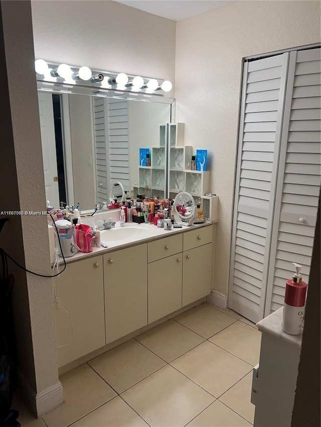 bathroom featuring tile patterned floors and vanity