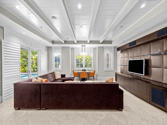 living room featuring beamed ceiling, light tile patterned floors, and french doors