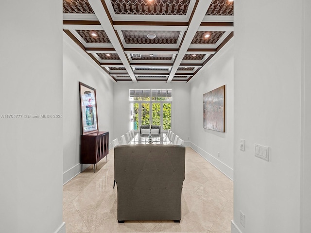 sitting room with beamed ceiling and coffered ceiling