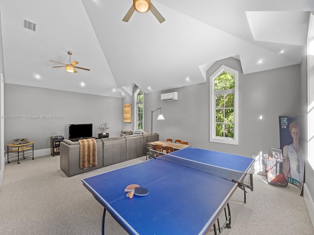 game room with light colored carpet, an AC wall unit, ceiling fan, and lofted ceiling