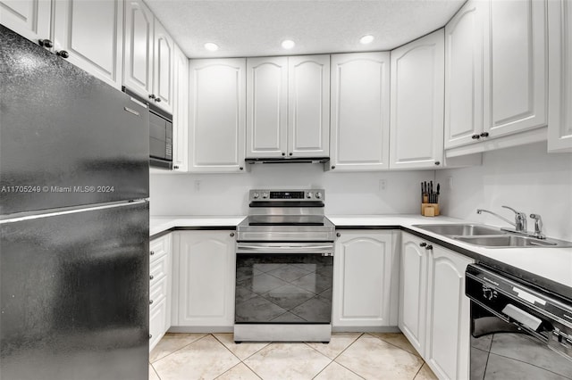 kitchen featuring white cabinets, sink, light tile patterned flooring, and black appliances