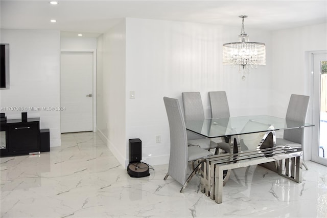 dining space with a notable chandelier