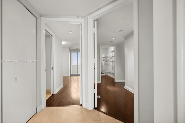 hallway featuring light tile patterned floors