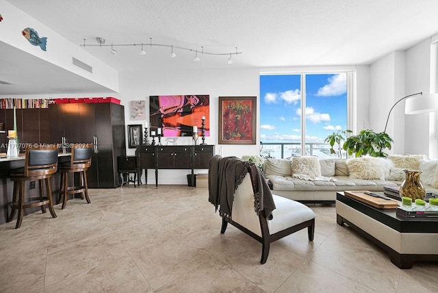 living room with a textured ceiling