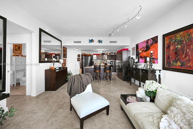 living room featuring a textured ceiling